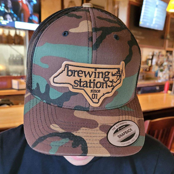 Green, beige and black brewing station since 01 trucker hat